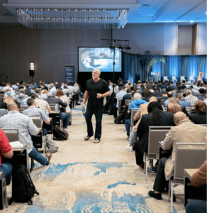 Man talking in center in conference